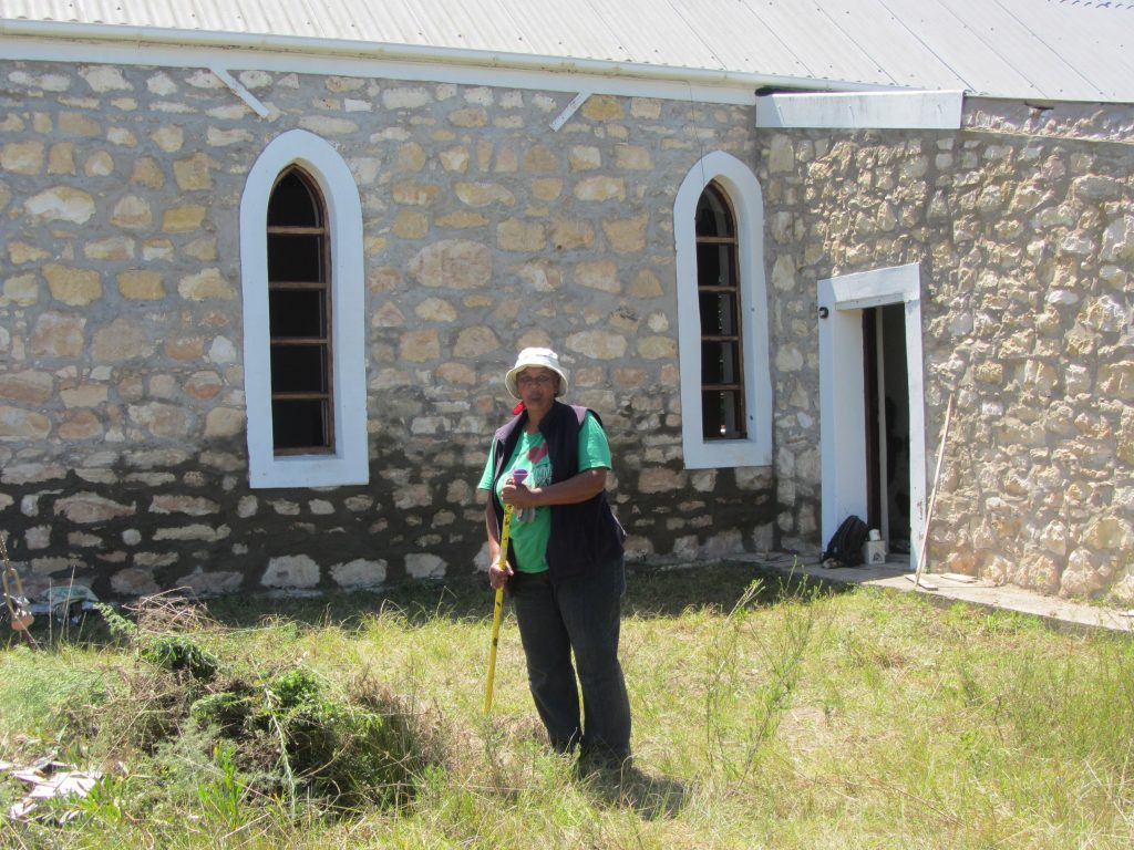 Beth clearing up the outside of the church