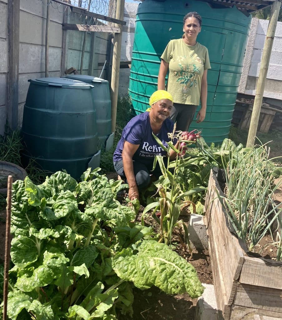 Sustainability Projects - Rachel and Chrishene growing food at the new home office