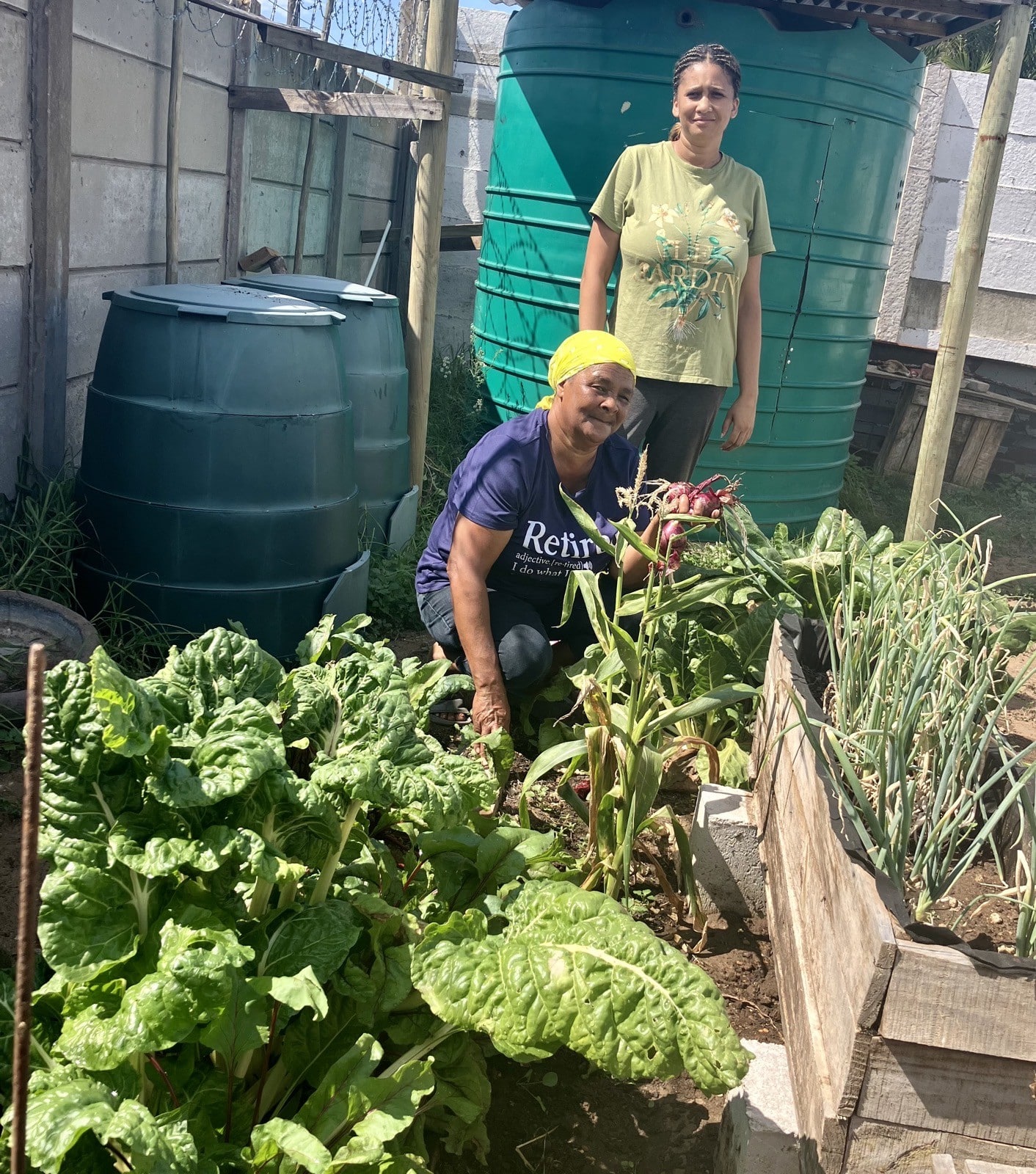 Sustainability Projects - Rachel and Chrishene growing food at the new home office